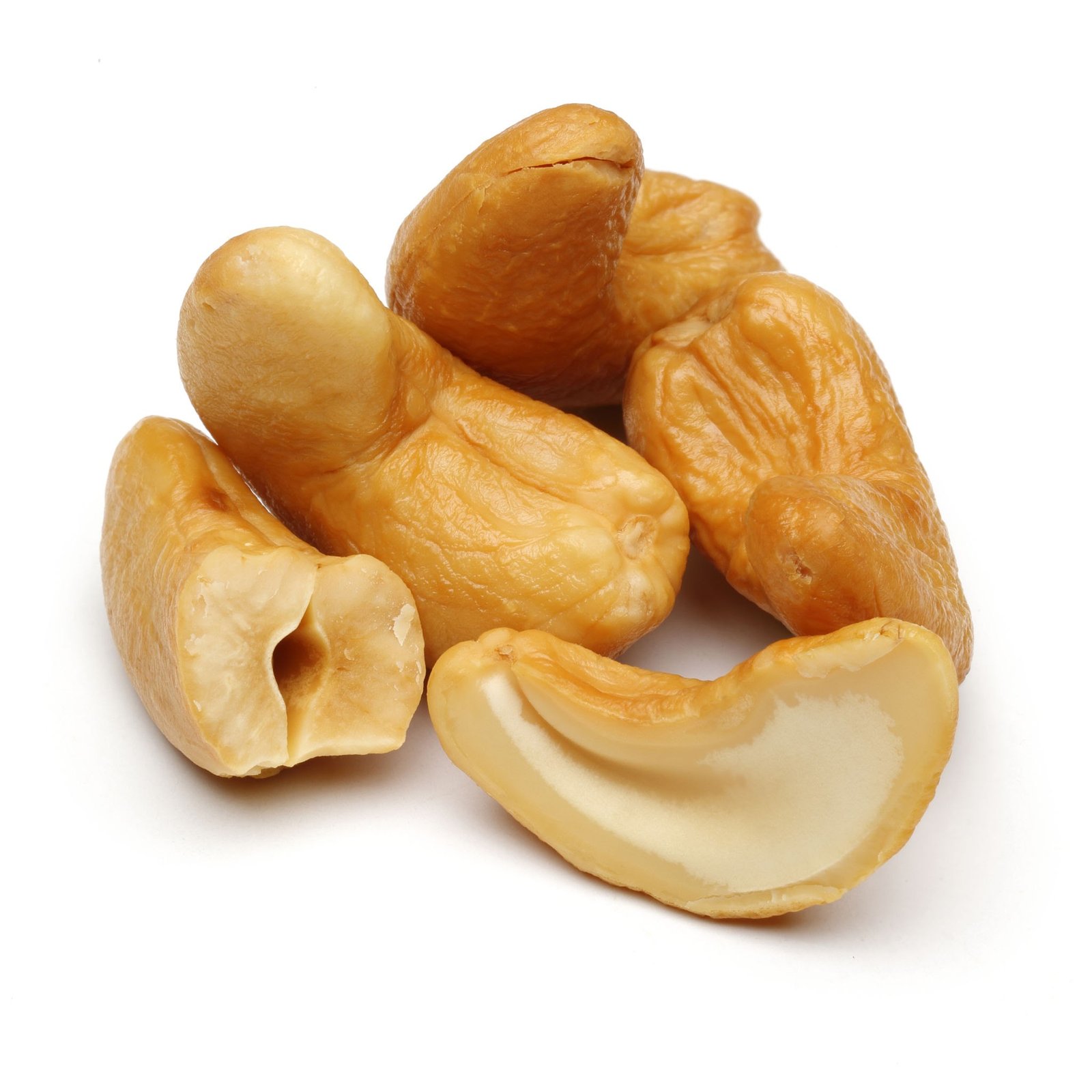Cashews on white background including full and horizantal half pieces.